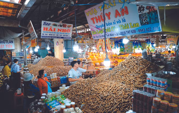 ផ្ដោះប្ដូរពាណិជ្ជកម្មនៅតំបន់ព្រំដែនខេត្ត អានយ៉ាង ảnh 3