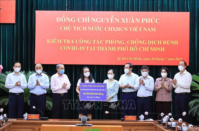 លោកប្រធានរដ្ឋ ង្វៀនស៊ន់ភុក អញ្ជើញមកប្រជុំការងារជាមួយថ្នាក់ដឹកនាំទីក្រុង ហូជីមិញ អំពីការងារបង្ការទប់ស្កាត់ការរីករាលដាលនៃជំងឺកូវីដ​ - ១៩ ảnh 2